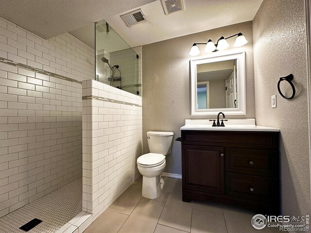 6502 Carmichael St, Fort Collins, CO 80528 - full bath with visible vents, toilet, tile patterned floors, and a walk in shower