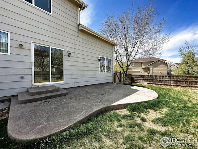 6502 Carmichael St, Fort Collins, CO 80528 - back of property with fence, a yard, and a patio