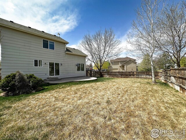 6502 Carmichael St, Fort Collins, CO 80528 - view of yard with a fenced backyard and a patio