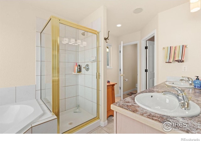 7421 18th St, Greeley, CO 80634 - bathroom with a garden tub, toilet, a sink, and a stall shower