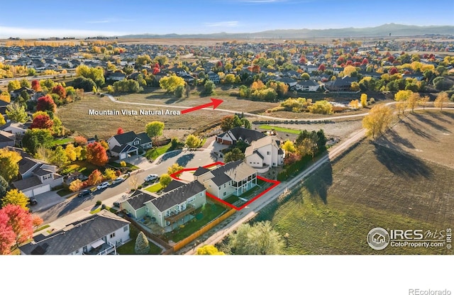 7421 18th St, Greeley, CO 80634 - birds eye view of property featuring a residential view and a mountain view