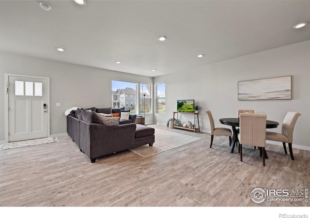 2838 Sykes Dr, Fort Collins, CO 80524 - living area featuring baseboards, light wood-style floors, and recessed lighting