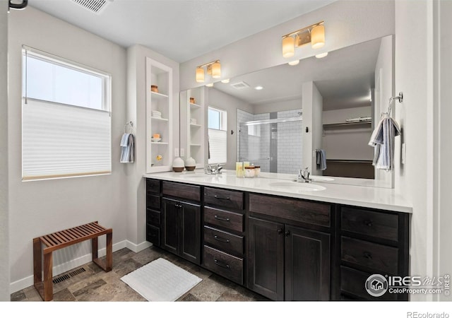 2838 Sykes Dr, Fort Collins, CO 80524 - bathroom featuring a shower stall, baseboards, a sink, and double vanity