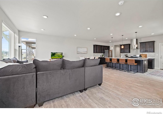 2838 Sykes Dr, Fort Collins, CO 80524 - living area featuring light wood-style flooring and recessed lighting