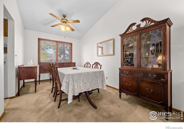 2417 15th Ave, Longmont, CO 80503 - dining area with baseboards, vaulted ceiling, light colored carpet, and ceiling fan