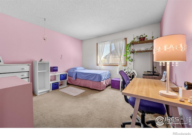 2417 15th Ave, Longmont, CO 80503 - bedroom with carpet floors and a textured ceiling