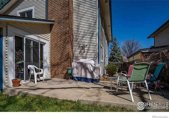 2417 15th Ave, Longmont, CO 80503 - view of patio featuring grilling area and fence