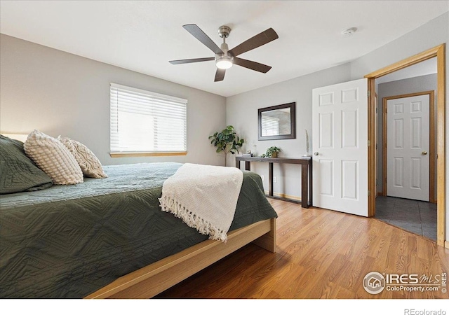 1114 Berwick Ct, Fort Collins, CO 80524 - bedroom with light wood-style floors and ceiling fan