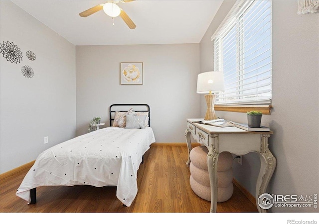 1114 Berwick Ct, Fort Collins, CO 80524 - bedroom with wood finished floors, baseboards, and ceiling fan