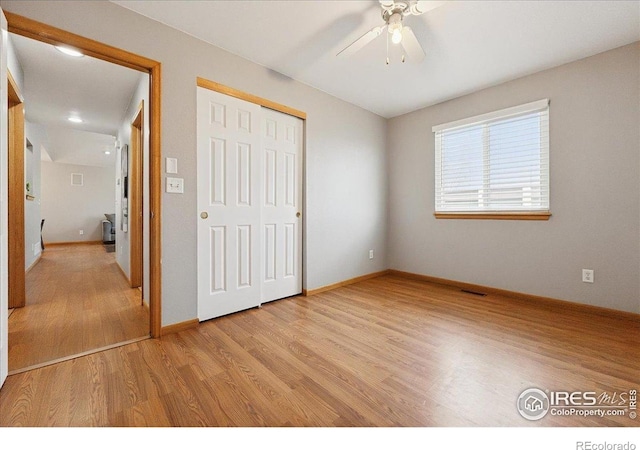 1114 Berwick Ct, Fort Collins, CO 80524 - unfurnished bedroom with light wood-style flooring, baseboards, a closet, and a ceiling fan