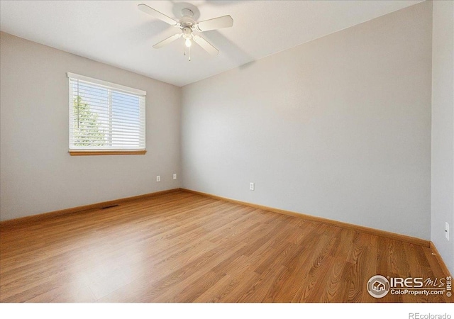 1114 Berwick Ct, Fort Collins, CO 80524 - spare room with light wood finished floors, a ceiling fan, and baseboards