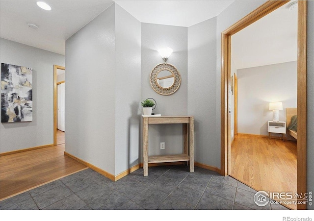 1114 Berwick Ct, Fort Collins, CO 80524 - hall with tile patterned floors and baseboards