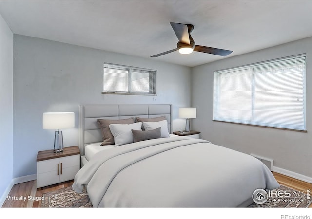 4580 Balsam St, Wheat Ridge, CO 80033 - bedroom featuring multiple windows, wood finished floors, and baseboards