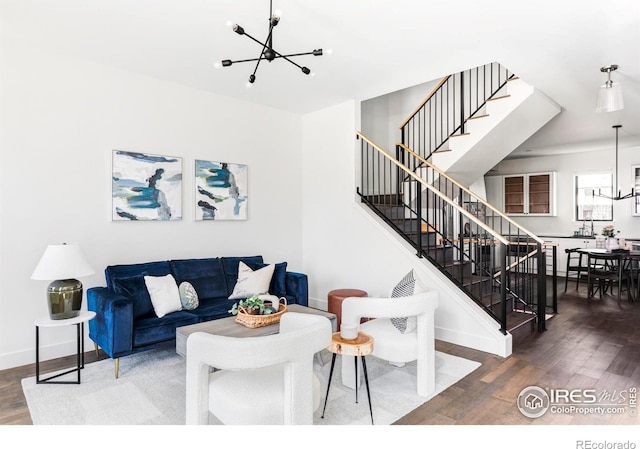 859 30th St, Denver, CO 80205 - living room with a chandelier, wood finished floors, and stairs