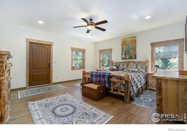 223 Kings Canyon Rd, Bellvue, CO 80512 - bedroom with multiple windows, wood finished floors, recessed lighting, baseboards, and ceiling fan