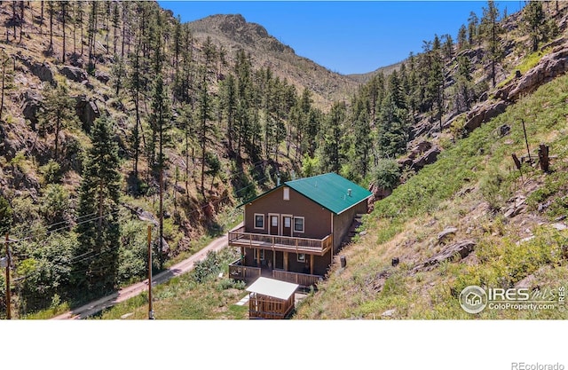 223 Kings Canyon Rd, Bellvue, CO 80512 - view of mountain background featuring a forest