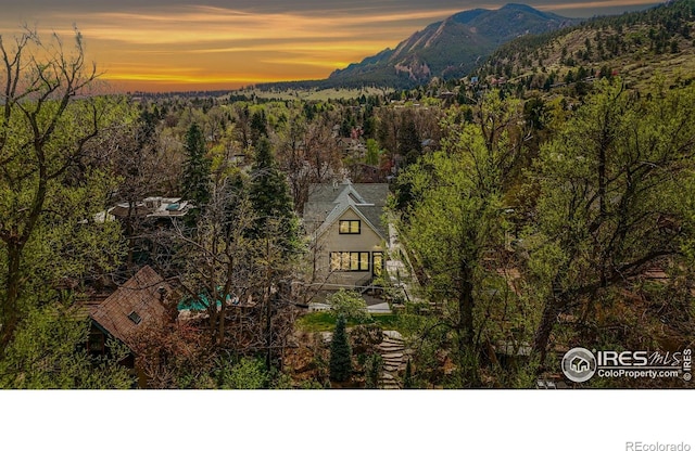 563 Arapahoe Ave, Boulder, CO 80302 - aerial view at dusk of a mountain view and a forest view