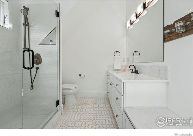563 Arapahoe Ave, Boulder, CO 80302 - bathroom featuring vanity, a shower stall, toilet, and baseboards