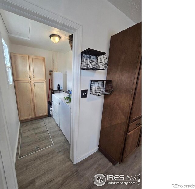 409 N 4th Ave, Sterling, CO 80751 - laundry room with washing machine and dryer, light wood-style floors, and baseboards