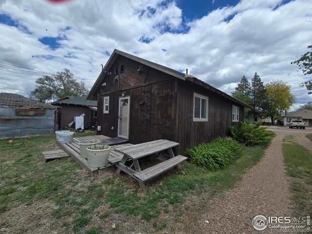 409 N 4th Ave, Sterling, CO 80751 - back of house with an outbuilding