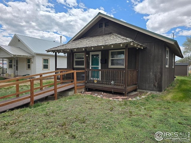 409 N 4th Ave, Sterling, CO 80751 - back of property with a yard and a porch