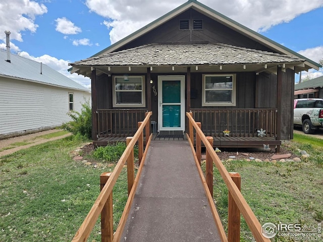 409 N 4th Ave, Sterling, CO 80751 - view of front of home with a porch and a front yard