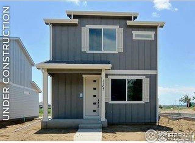 1039 Spartan Ave, Berthoud, CO 80513 - view of front of property featuring board and batten siding