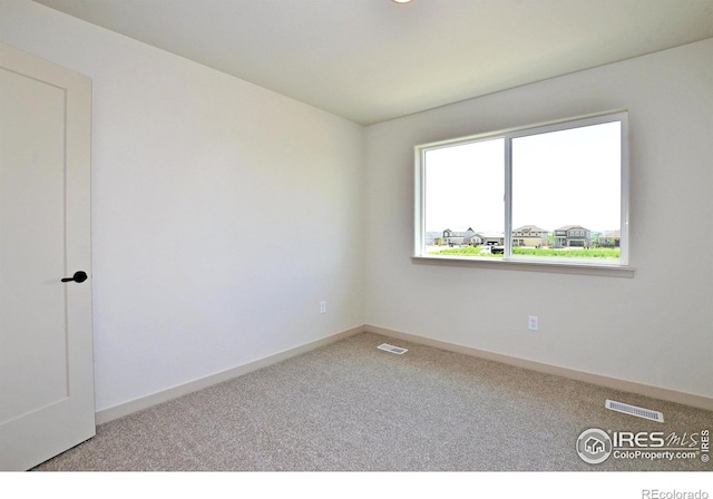 1039 Spartan Ave, Berthoud, CO 80513 - unfurnished room featuring carpet floors, visible vents, and baseboards