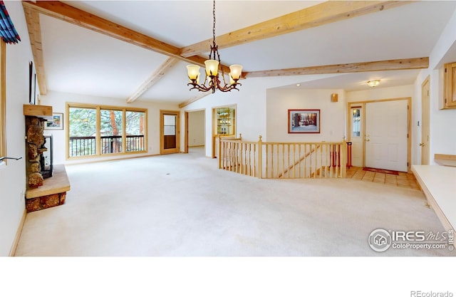 1162 Fairway Club Ln Unit 1, Estes Park, CO 80517 - unfurnished living room with a notable chandelier, vaulted ceiling with beams, and light carpet