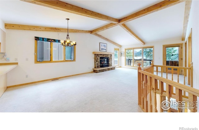 1162 Fairway Club Ln Unit 1, Estes Park, CO 80517 - living area with carpet, a fireplace, baseboards, lofted ceiling with beams, and a chandelier