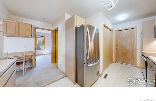 1162 Fairway Club Ln Unit 1, Estes Park, CO 80517 - kitchen with light countertops, visible vents, appliances with stainless steel finishes, and light brown cabinets