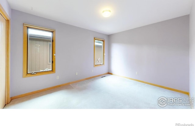 1162 Fairway Club Ln Unit 1, Estes Park, CO 80517 - spare room featuring carpet and baseboards