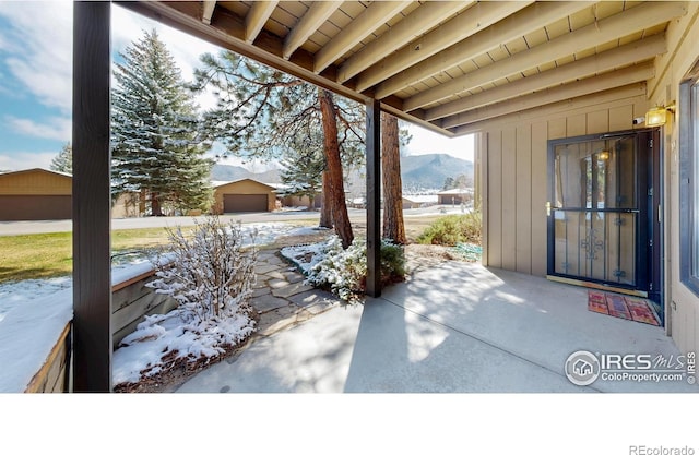 1162 Fairway Club Ln Unit 1, Estes Park, CO 80517 - snow covered patio featuring a mountain view