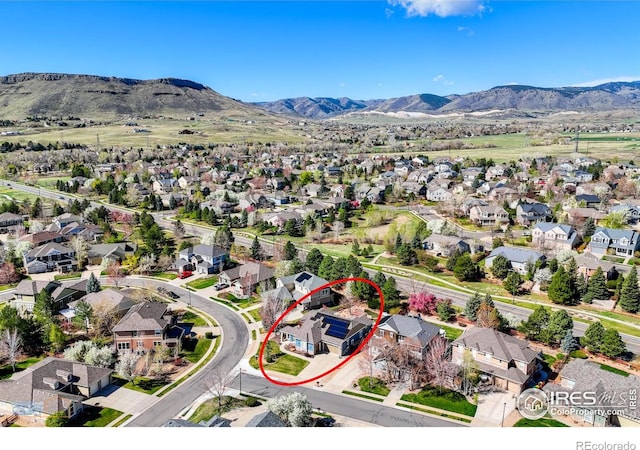 aerial view featuring a mountain view and a residential view
