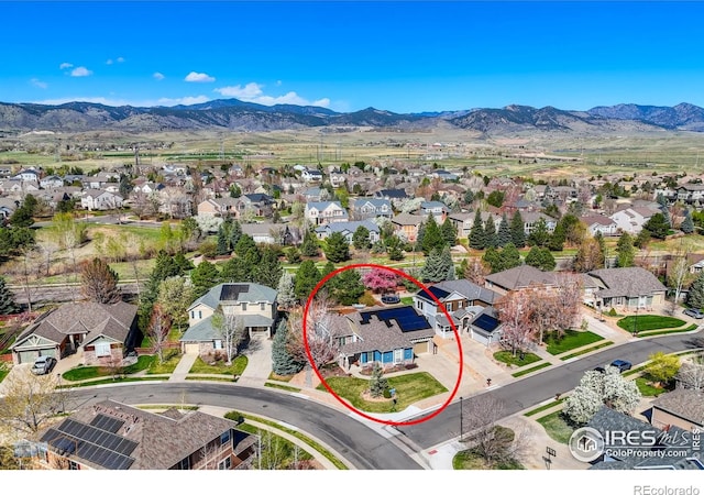 drone / aerial view featuring a mountain view and a residential view