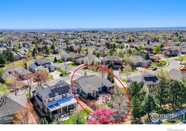 birds eye view of property with a residential view