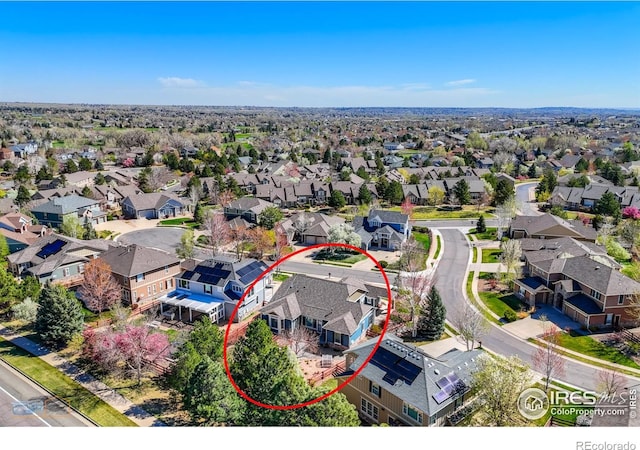 birds eye view of property with a residential view
