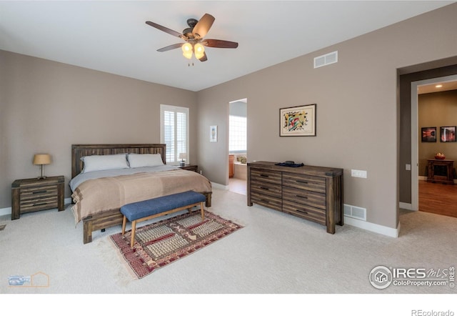 bedroom featuring baseboards, visible vents, and carpet