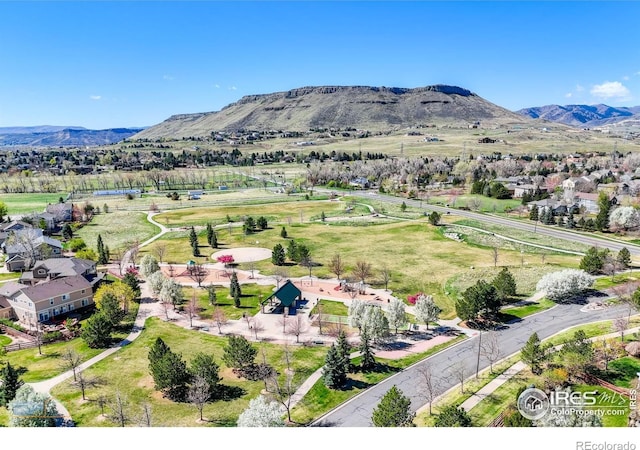 birds eye view of property featuring a mountain view