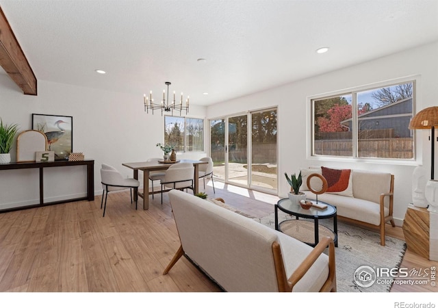 7102 S Harrison Ct, Centennial, CO 80122 - living room with light wood-type flooring, a chandelier, recessed lighting, and baseboards