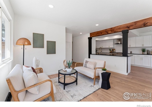 7102 S Harrison Ct, Centennial, CO 80122 - living room featuring light wood-style floors, recessed lighting, and baseboards