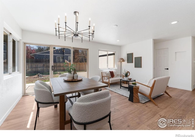 7102 S Harrison Ct, Centennial, CO 80122 - dining room featuring a chandelier, recessed lighting, baseboards, and light wood-style flooring