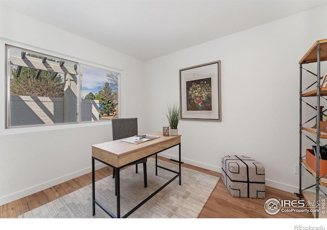 7102 S Harrison Ct, Centennial, CO 80122 - office featuring wood finished floors and baseboards