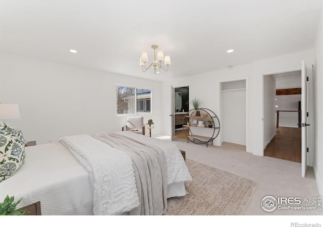 7102 S Harrison Ct, Centennial, CO 80122 - bedroom with a chandelier, light colored carpet, recessed lighting, and a closet