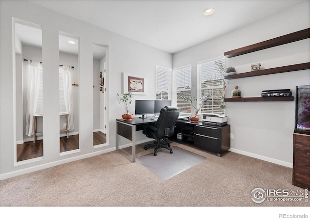 carpeted office space with recessed lighting and baseboards