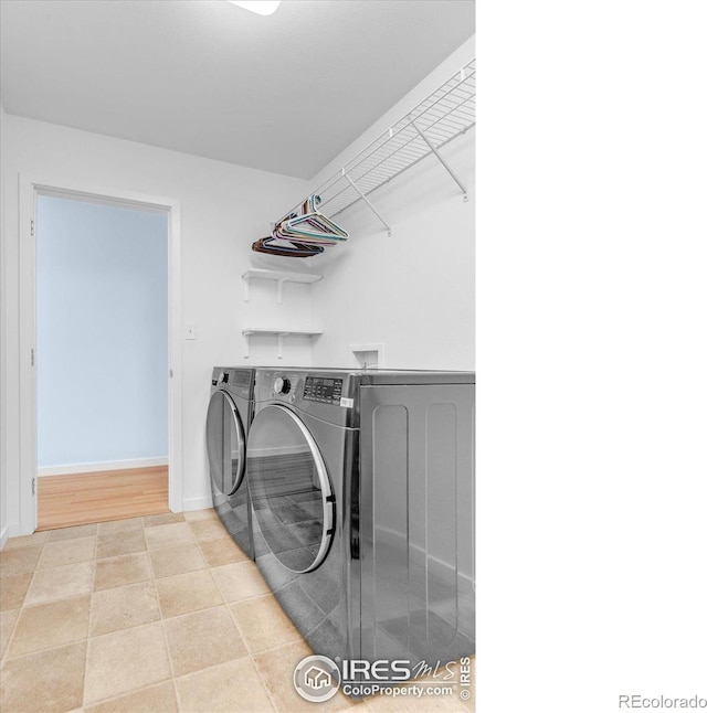195 S 35th St, Boulder, CO 80305 - clothes washing area with baseboards, washing machine and dryer, and laundry area