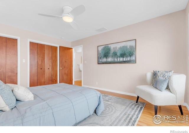 195 S 35th St, Boulder, CO 80305 - bedroom with two closets, wood finished floors, baseboards, and ceiling fan