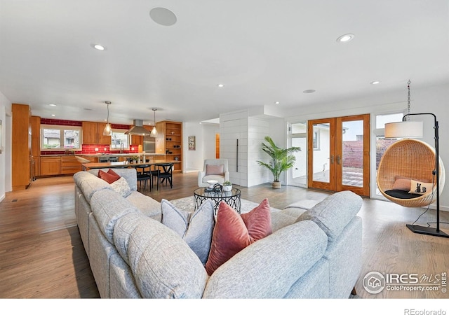 living room featuring recessed lighting and light wood-style flooring