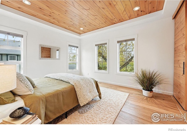 bedroom featuring recessed lighting, wooden ceiling, and a raised ceiling
