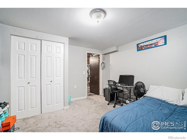 bedroom featuring a closet, carpet, and baseboards